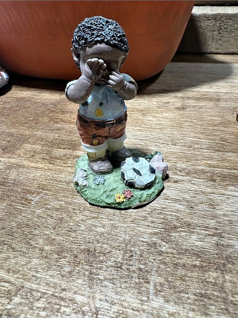 Small soccer boy figurine